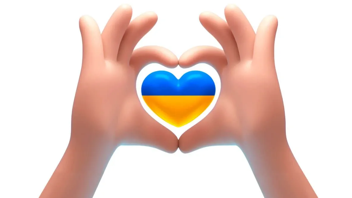 Руки утворюють серце навколо емодзі з прапором України. Київстар підтримує ЗСУ та допомагає Україні